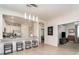 Open concept kitchen featuring stainless steel appliances and countertop seating at 17860 Palmetto Pass Ln, Punta Gorda, FL 33982