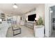 Open concept living room with tile flooring and neutral decor at 17860 Palmetto Pass Ln, Punta Gorda, FL 33982