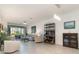Bright living room with neutral decor, tile flooring, and sliding glass doors to the patio at 17860 Palmetto Pass Ln, Punta Gorda, FL 33982