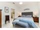 Inviting main bedroom featuring neutral decor, ensuite bathroom, and natural light at 17860 Palmetto Pass Ln, Punta Gorda, FL 33982