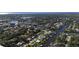 Expansive aerial view of a waterfront community with canals, houses, and mature landscaping at 18427 Goodman Cir, Port Charlotte, FL 33948