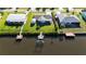 Aerial view of backyard, canal, dock with boat lift in waterfront community at 18427 Goodman Cir, Port Charlotte, FL 33948