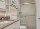 Bathroom showcasing a vanity with granite countertops, a walk-in shower and classic decor at 18427 Goodman Cir, Port Charlotte, FL 33948