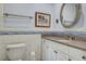 Bathroom featuring vanity with granite counters, updated fixtures, and decor at 18427 Goodman Cir, Port Charlotte, FL 33948