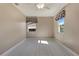 Bedroom featuring light wood-look flooring, natural light, and a ceiling fan at 18427 Goodman Cir, Port Charlotte, FL 33948