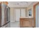 Bright kitchen with light wood cabinetry, granite counters, tile flooring, and ample natural light at 18427 Goodman Cir, Port Charlotte, FL 33948