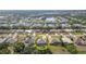 Aerial view shows the location of the property in a community with a swimming pool in a yard, close to a lake at 2132 Nuremberg Blvd, Punta Gorda, FL 33983