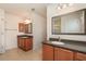 Double vanity bathroom with granite countertops and wood cabinets at 2132 Nuremberg Blvd, Punta Gorda, FL 33983