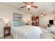 Bedroom featuring a bed, ceiling fan, and desk with built-in cabinets at 2132 Nuremberg Blvd, Punta Gorda, FL 33983