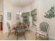 Cozy breakfast nook with round table and large windows at 2132 Nuremberg Blvd, Punta Gorda, FL 33983