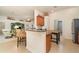 Open kitchen and living area with breakfast bar and tile flooring at 2132 Nuremberg Blvd, Punta Gorda, FL 33983