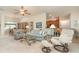 Open living room with neutral decor, carpet floors, ceiling fan, and an open floor plan to other rooms at 2132 Nuremberg Blvd, Punta Gorda, FL 33983