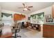 A comfortable office space with wooden cabinetry, a ceiling fan, and a window with a scenic view at 2132 Nuremberg Blvd, Punta Gorda, FL 33983