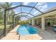 Backyard with screened-in pool, providing a private and relaxing outdoor space at 2132 Nuremberg Blvd, Punta Gorda, FL 33983