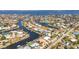 A high angle showcases the residential neighborhood with waterfront homes along winding canals and waterway access at 2350 W Marion Ave, Punta Gorda, FL 33950