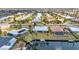 Aerial view of a canal-front neighborhood showcases well-maintained homes, private docks, and lush landscaping at 2350 W Marion Ave, Punta Gorda, FL 33950