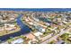 High angle shows the residential neighborhood with waterfront homes along winding canals and ocean access at 2350 W Marion Ave, Punta Gorda, FL 33950