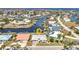 Beautiful waterfront home with a tile roof, lush landscaping, and private boat dock and canal access at 2350 W Marion Ave, Punta Gorda, FL 33950