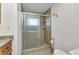 Bathroom featuring a glass door shower and neutral tile flooring at 2350 W Marion Ave, Punta Gorda, FL 33950