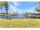 Lush lawn leads to a private boat dock and lift, perfectly situated on the tranquil waterfront canal at 2350 W Marion Ave, Punta Gorda, FL 33950