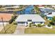 Well maintained single-story home boasts beautiful landscaping, a two-car garage and a new gray tile roof at 2350 W Marion Ave, Punta Gorda, FL 33950