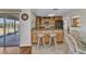 Eat-in kitchen with an island and granite countertops featuring stainless steel appliances and wood cabinetry at 2350 W Marion Ave, Punta Gorda, FL 33950