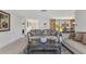 Inviting living room featuring neutral tones, plush seating, and a large window, offering a comfortable space at 2350 W Marion Ave, Punta Gorda, FL 33950