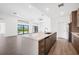 Stylish kitchen with quartz island perfect for entertaining, open to living area with backyard views at 24259 Peppercorn Rd, Punta Gorda, FL 33955