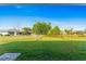 Expansive backyard with lush lawn, partial fencing, and mature trees at 25336 Deep Creek Blvd, Punta Gorda, FL 33983