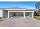 Attached two car garage with spacious driveway provides convenient parking at 25336 Deep Creek Blvd, Punta Gorda, FL 33983