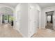 Bright hallway with wood floors leading to the living area at 25336 Deep Creek Blvd, Punta Gorda, FL 33983