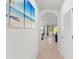 Hallway with wood floors leading to the living area and kitchen at 25336 Deep Creek Blvd, Punta Gorda, FL 33983