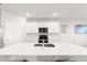Bright kitchen view highlighting the stainless steel appliances, countertop, and modern cabinetry at 25336 Deep Creek Blvd, Punta Gorda, FL 33983