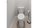 Close up of toilet with neutral walls and flooring, includes toilet paper stand at 25336 Deep Creek Blvd, Punta Gorda, FL 33983