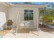 Relaxing back patio area with outdoor seating and garden at 2631 Tomaso Rd, North Port, FL 34287