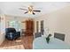 Spacious dining area with hardwood floors, a ceiling fan, and views to the living space at 2631 Tomaso Rd, North Port, FL 34287