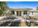 Charming single-story home with neutral exterior and sliding glass door entrance at 2631 Tomaso Rd, North Port, FL 34287