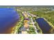 Aerial view of waterfront homes nestled along the river and community pond in a desirable neighborhood at 2917 Mill Creek Rd, Port Charlotte, FL 33953