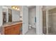 Bathroom featuring granite counters, a glass shower, and neutral gray tile at 2917 Mill Creek Rd, Port Charlotte, FL 33953