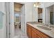 Bathroom showcasing a double vanity with a granite countertop and wood cabinetry at 2917 Mill Creek Rd, Port Charlotte, FL 33953