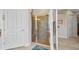 Bright bathroom showcasing a tiled shower and convenient door to the hallway at 2917 Mill Creek Rd, Port Charlotte, FL 33953