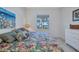Comfortable bedroom offering a view of the water, plus a cozy floral comforter at 2917 Mill Creek Rd, Port Charlotte, FL 33953