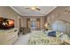 Relaxing bedroom features a ceiling fan, coastal decor, and abundant natural light at 2917 Mill Creek Rd, Port Charlotte, FL 33953