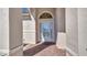 Inviting front entryway featuring a decorative glass door and brick pavers at 2917 Mill Creek Rd, Port Charlotte, FL 33953