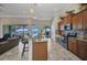Well-equipped kitchen with granite countertops, stainless steel appliances, and bar seating overlooking waterfront views at 2917 Mill Creek Rd, Port Charlotte, FL 33953
