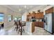 Open kitchen featuring stainless steel appliances, and a breakfast bar with views of the water at 2917 Mill Creek Rd, Port Charlotte, FL 33953