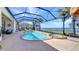 Gorgeous screened pool and spa overlooking a tranquil waterfront view at 2917 Mill Creek Rd, Port Charlotte, FL 33953