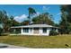 Charming single-story home with well-maintained lawn and decorative stone accents at 3308 Pinetree St, Port Charlotte, FL 33952