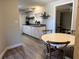 Eat-in kitchen featuring modern finishes and neutral color palette at 3308 Pinetree St, Port Charlotte, FL 33952