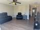 Cozy living room showcasing modern floors, neutral walls, and comfortable seating at 3308 Pinetree St, Port Charlotte, FL 33952